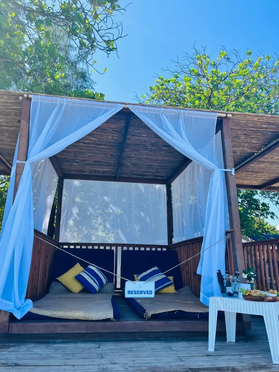 Limited Private Beach Lounge (optional extra, +$70, book in advance): private shaded lounge with curtains and two day beds at Sol Y Mar