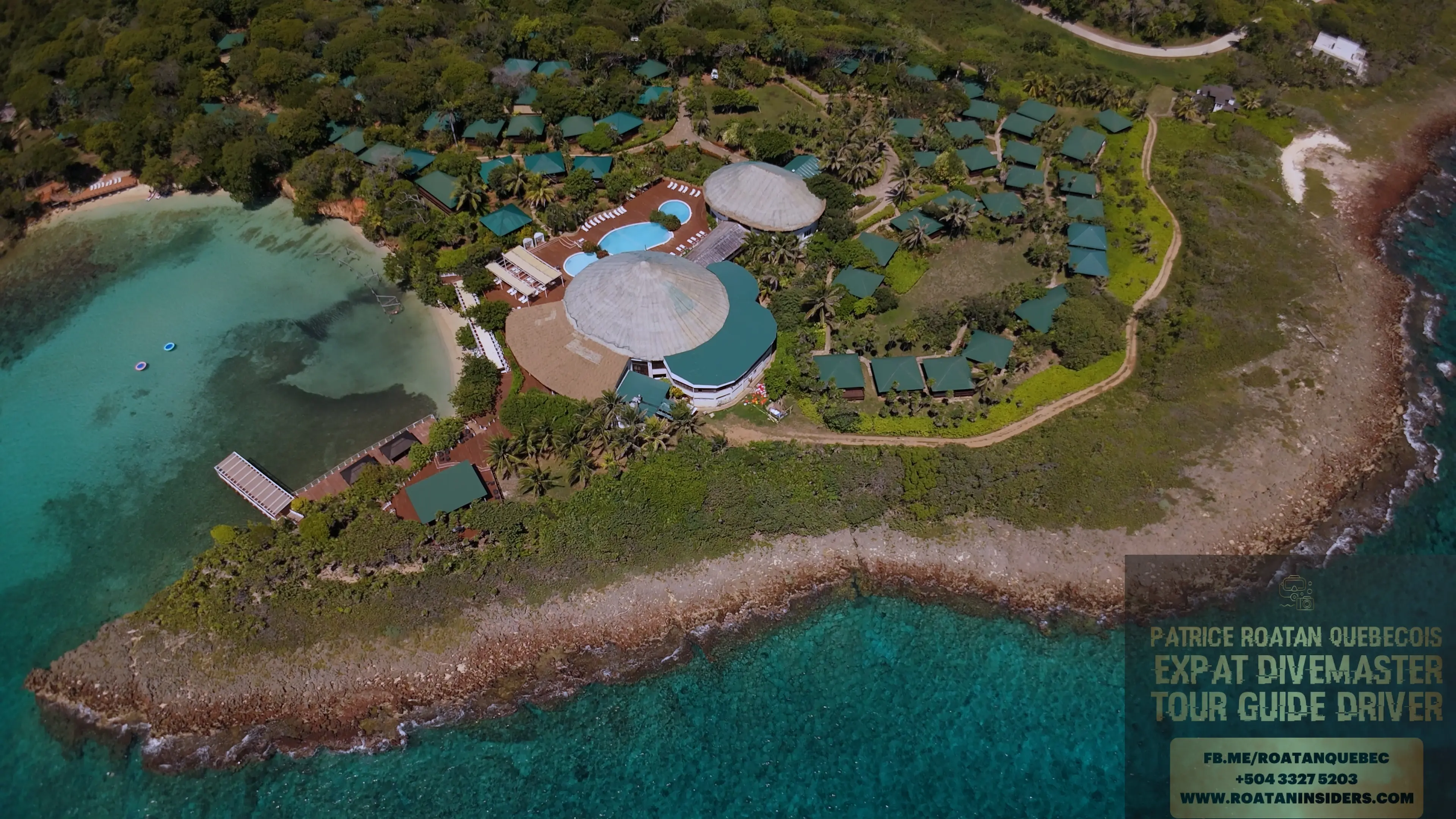 Aerial of Media Luna Resort’s pool, palapas and grounds on its private point, Roatán
