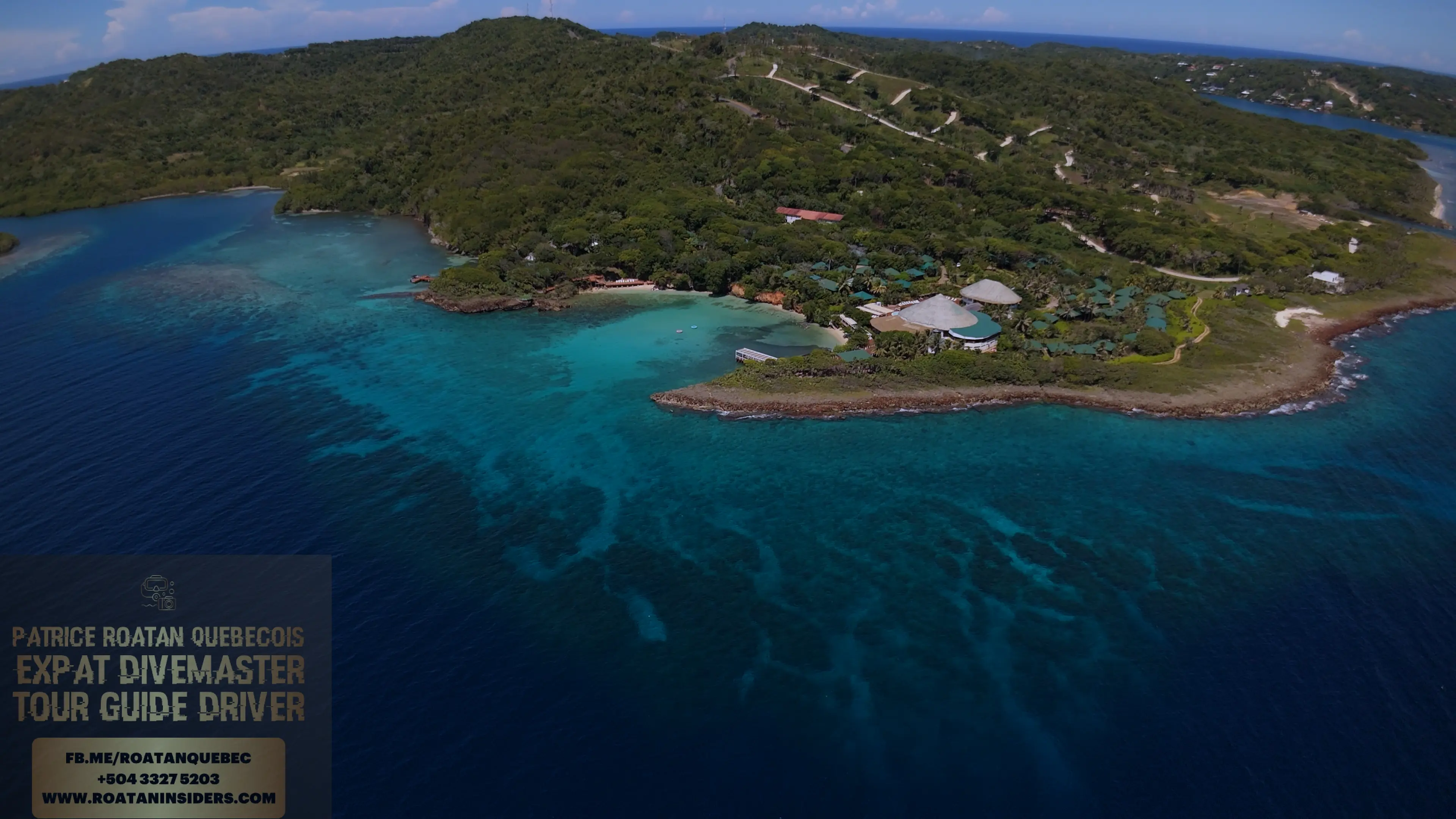 Aerial of Media Luna Resort and its reef-fringed private point, Roatán