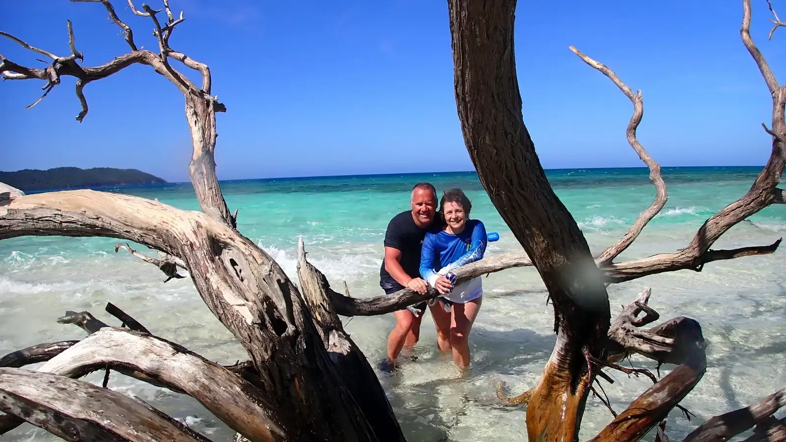 MDesktop A Couple standing on the Beach of Pigeon Cay with Barbareta Island in the Background