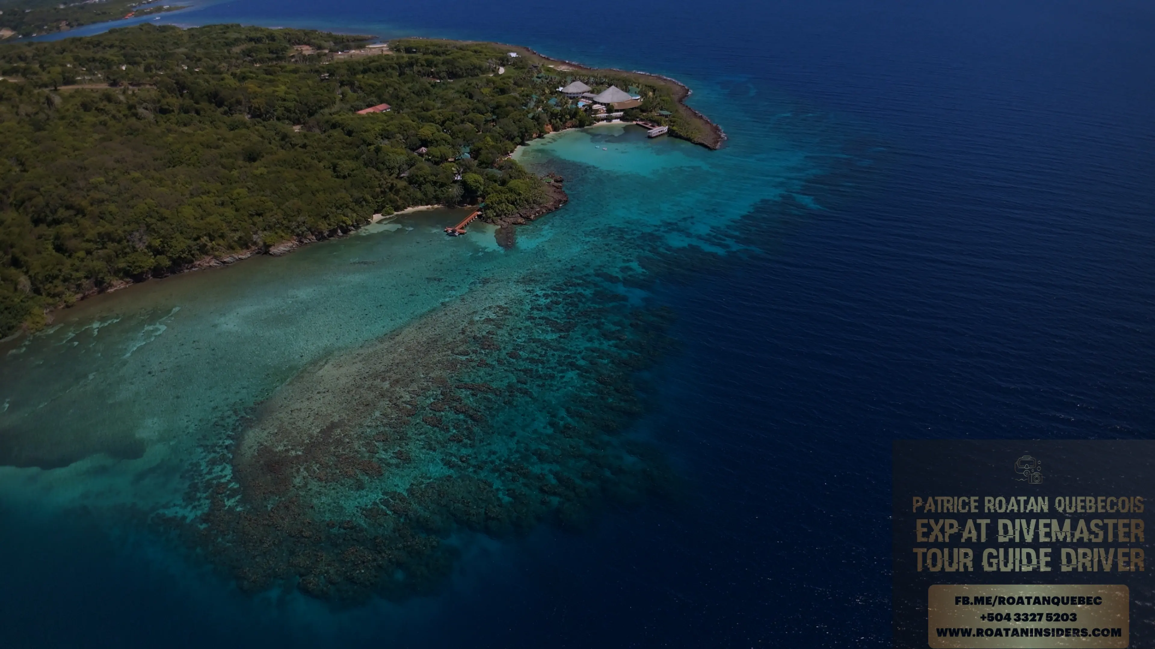 Aerial drone view of Media Luna’s reef and point at Caribe Point, Roatán — top snorkeling