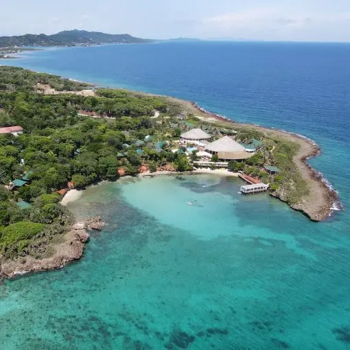 An aerial view of the beach and pool of the all-inclusive Media Luna hotel